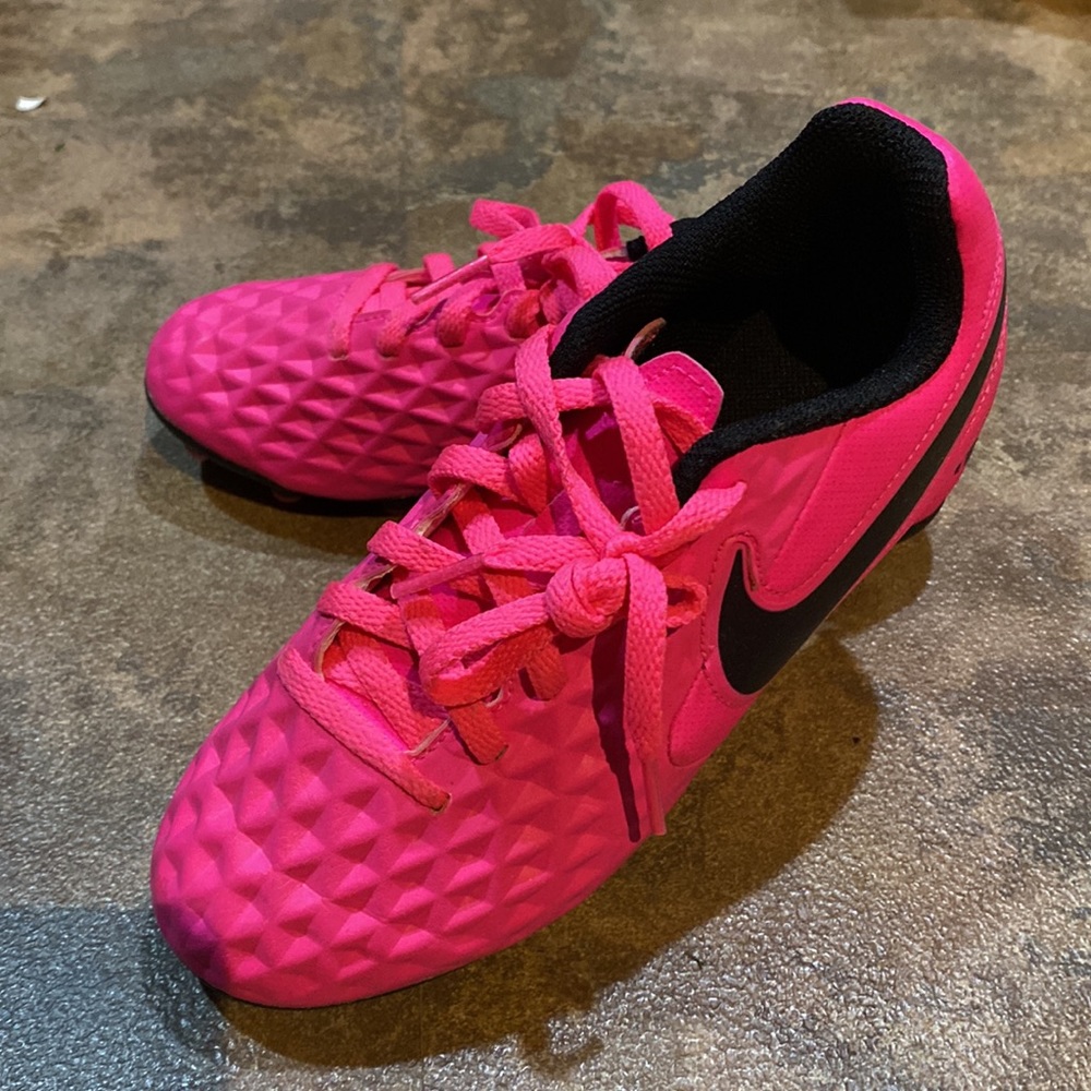Girls hot pink soccer cleats and shin guards